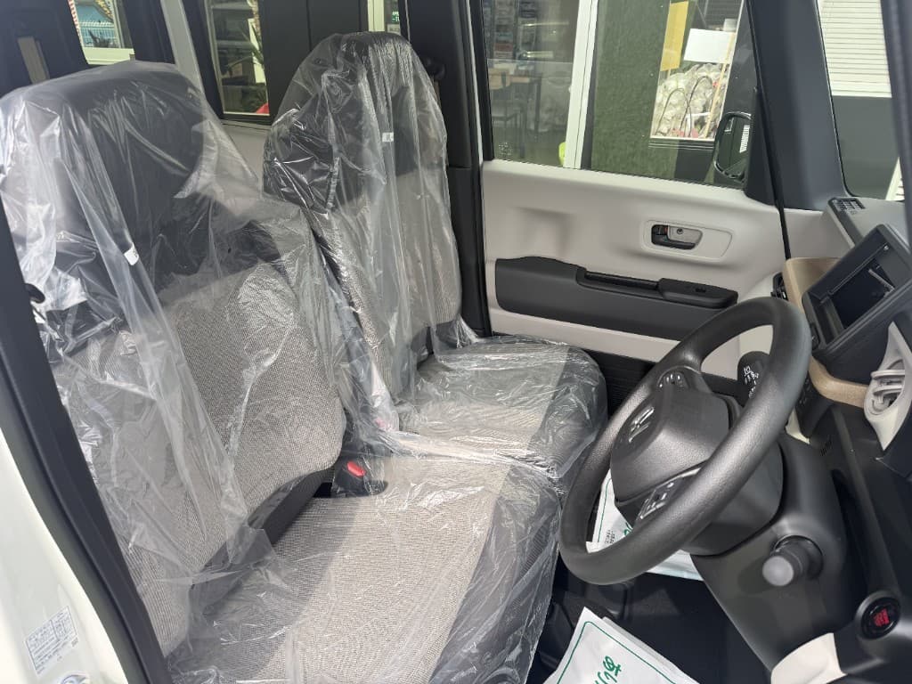Unused car interior with plastic covering